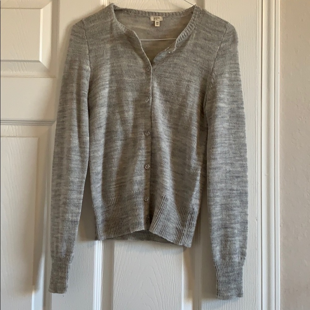 Full sleeve button down crew neck sweater.